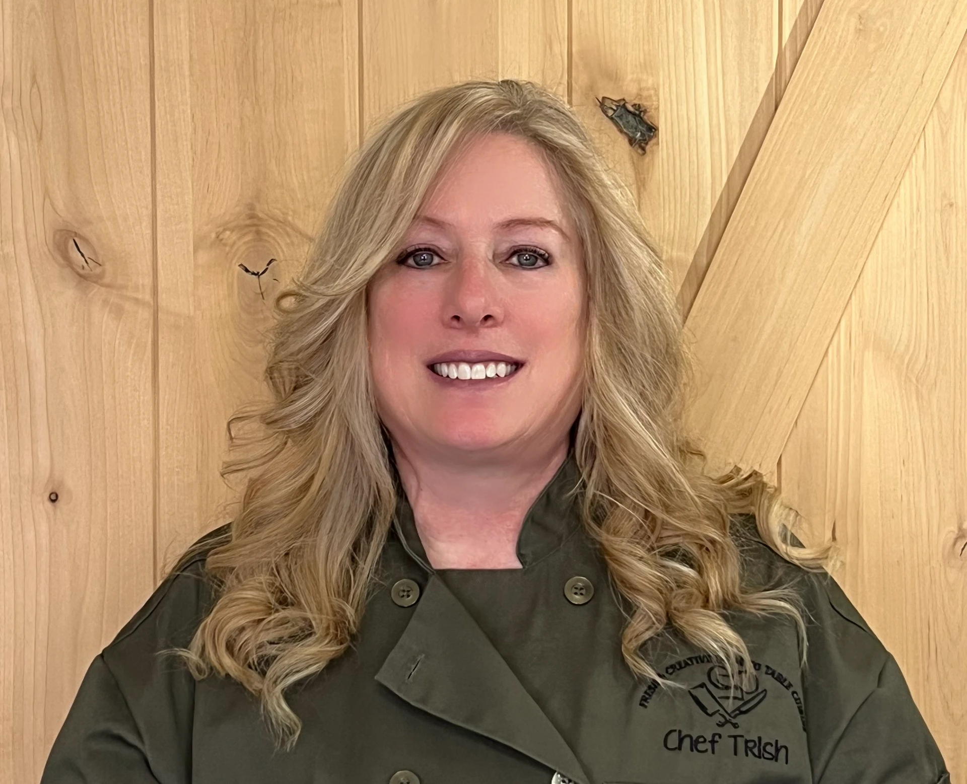 Chef Trish, head chef and owner, wearing her embroidered chef coat.